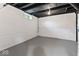 Unfinished basement area with painted walls, ceiling, a small window, and concrete floor at 2719 Denison St, Indianapolis, IN 46241