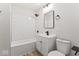 Well-lit bathroom with a modern vanity, black fixtures, and a tiled shower-over-tub at 2719 Denison St, Indianapolis, IN 46241