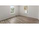 Bedroom featuring wood flooring and two windows that provide great light at 2719 Denison St, Indianapolis, IN 46241