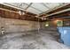 Spacious garage with block walls and concrete floor, offering ample storage and workspace at 2719 Denison St, Indianapolis, IN 46241