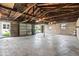 An unfinished two-car garage is spacious and has an overhead door at 2719 Denison St, Indianapolis, IN 46241