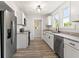 Modern kitchen features stainless steel appliances, sleek granite countertops, and beautiful cabinetry at 2719 Denison St, Indianapolis, IN 46241