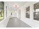 Bright sunroom featuring large windows offering plenty of natural light and views of the neighborhood at 2719 Denison St, Indianapolis, IN 46241