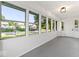 Bright sunroom featuring large windows offering plenty of natural light and views of the neighborhood at 2719 Denison St, Indianapolis, IN 46241