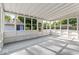 Bright sunroom with large windows offering natural light and views of the backyard at 2719 Denison St, Indianapolis, IN 46241