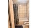 Bathroom view with tub, shower curtain, and toilet at 2954 N Drexel Ave, Indianapolis, IN 46218