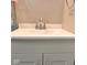 Bathroom sink with a silver faucet, white countertop, and gray cabinet at 2954 N Drexel Ave, Indianapolis, IN 46218