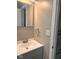 Bathroom sink with a silver faucet, white countertop, and gray cabinet at 2954 N Drexel Ave, Indianapolis, IN 46218