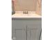 Bathroom sink with a silver faucet, white countertop, and gray cabinet at 2954 N Drexel Ave, Indianapolis, IN 46218