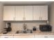Bright kitchen featuring stainless steel sink and modern cabinets at 2954 N Drexel Ave, Indianapolis, IN 46218