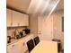 Functional kitchen features white cabinetry and updated countertops at 2954 N Drexel Ave, Indianapolis, IN 46218