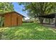 The backyard features a shed and a covered porch with a swing at 3529 Hunt St, Plainfield, IN 46168