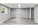 Spacious basement with gray walls, wood flooring, and ample natural light at 3529 Hunt St, Plainfield, IN 46168