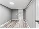 Bedroom features wood-look floors, neutral walls, and an adjacent closet, offering comfort and storage at 3529 Hunt St, Plainfield, IN 46168
