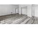 This bedroom features wood-look laminate flooring and a large closet at 3529 Hunt St, Plainfield, IN 46168