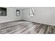 Clean, neutral bedroom featuring wood-look flooring and natural light; ready for your personal touch at 3529 Hunt St, Plainfield, IN 46168