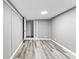 Clean bedroom features wood-look flooring, neutral paint, and a closet; perfect for relaxation at 3529 Hunt St, Plainfield, IN 46168