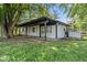 This home's exterior features white siding and black window trim at 3529 Hunt St, Plainfield, IN 46168