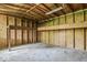This garage interior features open beams and a wooden platform at 3529 Hunt St, Plainfield, IN 46168
