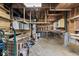 This garage interior features open beams and work benches with equipment at 3529 Hunt St, Plainfield, IN 46168