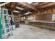 This garage interior features open beams, pegboard, and work benches at 3529 Hunt St, Plainfield, IN 46168