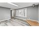 Living room featuring wood flooring and a window, providing ample natural light at 3529 Hunt St, Plainfield, IN 46168