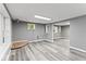 Living room with gray walls, wood flooring, a window, and a neutral color palette at 3529 Hunt St, Plainfield, IN 46168