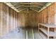 This shed interior includes open beams and a small workbench at 3529 Hunt St, Plainfield, IN 46168