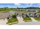 Aerial view of homes in a community, showcasing landscaping, water feature, and overall neighborhood layout at 3839 Albert Ln, Bargersville, IN 46106
