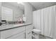 Well-lit bathroom with a modern vanity, spacious countertop, and a shower-tub combo for relaxation at 3839 Albert Ln, Bargersville, IN 46106