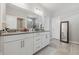 Modern bathroom with double vanity, sleek countertops, and a glass-enclosed shower at 3839 Albert Ln, Bargersville, IN 46106