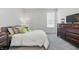Comfortable bedroom with gray carpet, offering a cozy retreat with a view of the window and closet space at 3839 Albert Ln, Bargersville, IN 46106