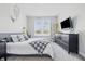 Bright bedroom with natural light and decorated with dream catcher and floral decor at 3839 Albert Ln, Bargersville, IN 46106