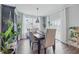 Inviting dining area featuring stylish chairs, a wooden table, and natural light from the sliding door at 3839 Albert Ln, Bargersville, IN 46106