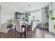 Bright dining room with modern table, chairs, and plenty of natural light from the large window at 3839 Albert Ln, Bargersville, IN 46106