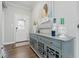 View of entryway featuring a gray console with wood floors and bright white walls at 3839 Albert Ln, Bargersville, IN 46106