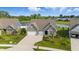Beautiful exterior of a home, showcasing its brick and siding facade, manicured lawn, and three-car garage at 3839 Albert Ln, Bargersville, IN 46106