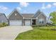 Beautiful single Gathering home featuring an attached three car garage and manicured lawn at 3839 Albert Ln, Bargersville, IN 46106
