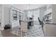 Home office with gray walls, built in bookcase, large desk and patterned rug at 3839 Albert Ln, Bargersville, IN 46106