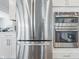 Close-up of kitchen appliances featuring a stainless steel refrigerator and a modern oven and microwave at 3839 Albert Ln, Bargersville, IN 46106