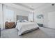 Bright main bedroom with a tufted headboard, and tasteful decor, offering a relaxing retreat at 3839 Albert Ln, Bargersville, IN 46106