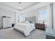 Serene main bedroom with plush carpet, a tufted headboard, and ample natural light at 3839 Albert Ln, Bargersville, IN 46106