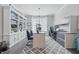 Bright home office with built-in shelves, a modern desk setup, and an elegant gray patterned rug at 3839 Albert Ln, Bargersville, IN 46106