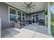 Spacious outdoor patio area with comfortable seating, a ceiling fan, and a view of the backyard at 3839 Albert Ln, Bargersville, IN 46106