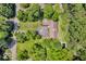 Aerial view showing property including mature trees, expansive green lawn, circular driveway, and pool at 450 W 93Rd St, Indianapolis, IN 46260