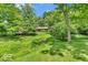 Home with mature trees and landscaping at 450 W 93Rd St, Indianapolis, IN 46260