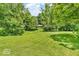 Inviting home surrounded by lush greenery, featuring a spacious lawn perfect for outdoor activities at 450 W 93Rd St, Indianapolis, IN 46260