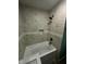 Bathroom with decorative tile and tub and shower with updated fixtures at 4715 Normal Ave, Indianapolis, IN 46226