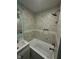 Bathroom showcasing a shower and tub combination with decorative tile and painted walls at 4715 Normal Ave, Indianapolis, IN 46226