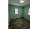 Light-filled bedroom featuring neutral walls and wood-look flooring at 4715 Normal Ave, Indianapolis, IN 46226